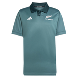 The All Blacks 25/26 Replica Training Jersey by adidas is a teal polo with short sleeves, a collar, and white adidas and All Blacks logos on the chest—a stylish choice for dedicated fans.