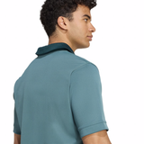A man with short curly hair models the All Blacks 25/26 Replica Training Jersey by adidas, shown from the back and side against a white background.
