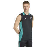 A young man faces forward, wearing the adidas All Blacks 25/26 Training Singlet and matching shorts—ideal attire for rugby training sessions.