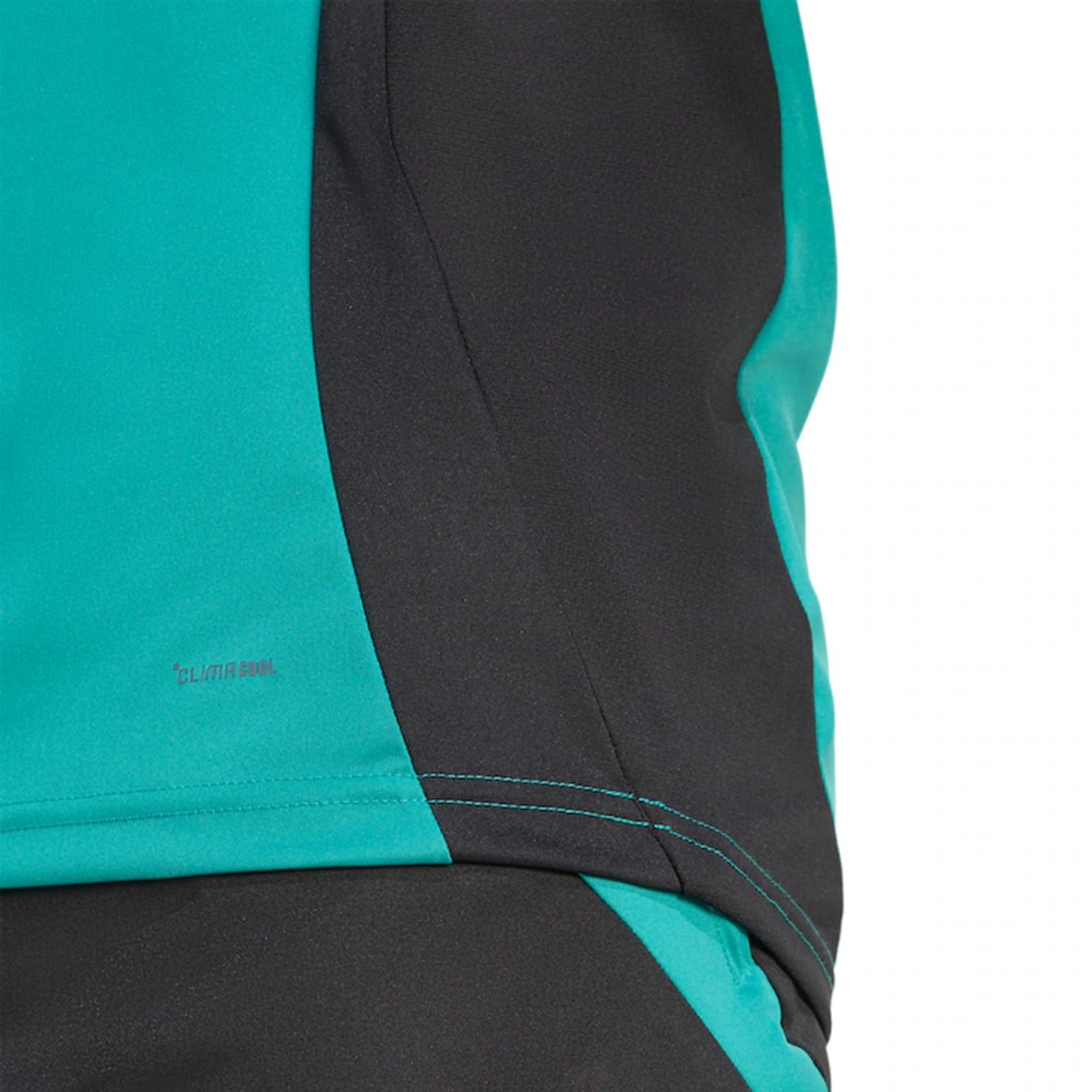 Close-up of the All Blacks 25/26 Performance T-Shirt by adidas, featuring teal and black colors, visible stitching, and a small "CLIMALITE" logo on the fabric.