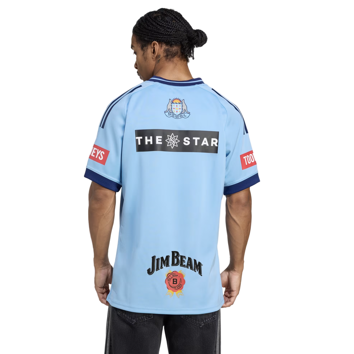 A man wearing the New South Wales Blues 25/26 Replica Home Jersey by adidas.