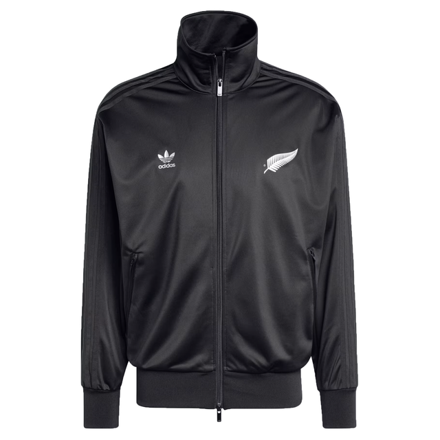 The Originals Limited Edition All Blacks Firebird Track Top by adidas is a black, recycled polyester track jacket with a zip-up front and high collar. Featuring a white fern emblem, it combines iconic design with functionality and sustainable style.