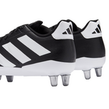 A close-up of two adidas Kakari Elite SG boots in Core Black/White/Core Black, featuring metal studs and detailed views of the side and heel.