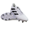 A pair of adidas Kakari SG rugby boots in White/Core Black/Silver Metallic, featuring black stripes and metal soft ground studs, are displayed—one upright and one showing the sole—against a plain white background.