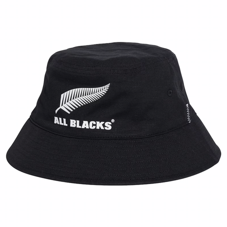 The All Blacks 25/26 Bucket Hat by adidas features a white fern leaf graphic and "ALL BLACKS" text on the front—an essential adidas bucket hat for All Blacks fans.