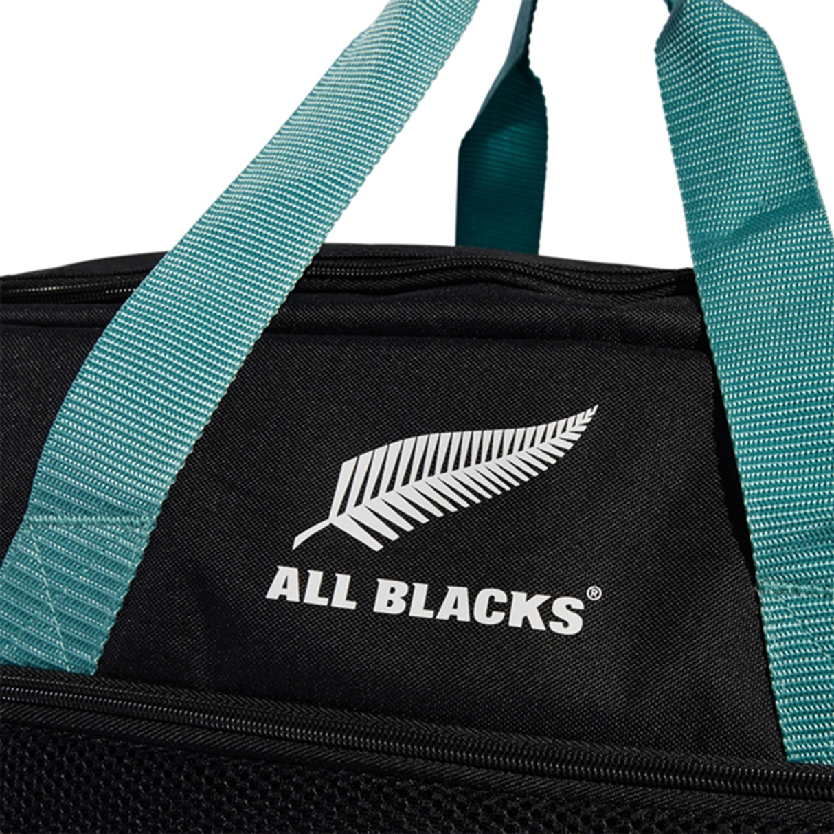 The adidas All Blacks 25/26 Duffle features teal handles, a black body, the iconic white silver fern, and "ALL BLACKS" text—ideal for rugby training or as your everyday adidas bag.
