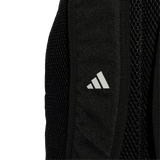 Close-up of black mesh fabric with a small white adidas logo on the right side, featured on the All Blacks 25/26 Backpack by adidas.
