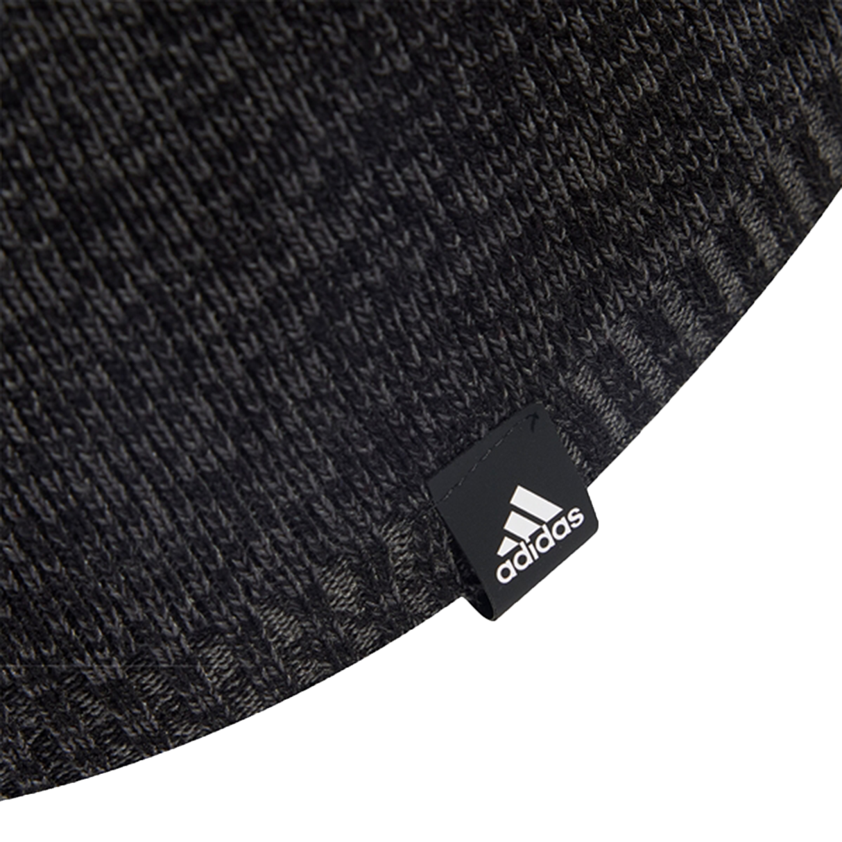 Close-up of a dark gray knit with a black adidas tag featuring the white logo and text—a must-have for fans of the All Blacks 25/26 Beanie by adidas.