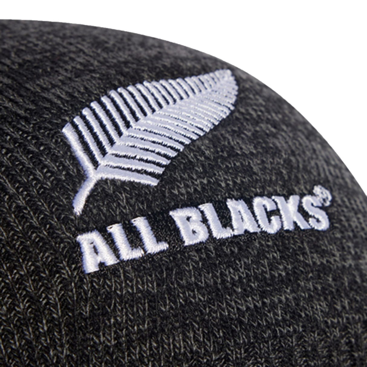 Close-up of the All Blacks 25/26 Beanie by adidas, showing a white embroidered fern and "ALL BLACKS" text—an official adidas accessory celebrating New Zealand rugby.