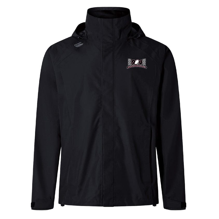 The Jacksonville Women's Rugby Elite Storm Jacket by EMB Canterbury is a black waterproof jacket with a hood, featuring a small embroidered logo on the upper left chest. Designed with Vaposhield Performance for enhanced breathability.
