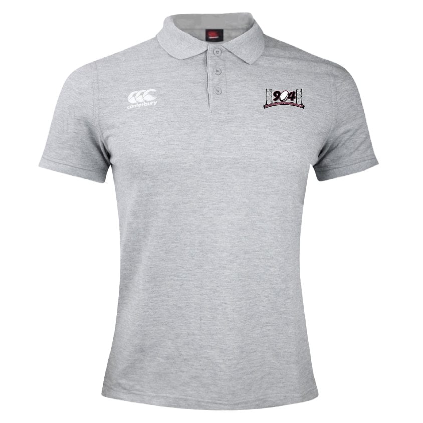 A grey Jacksonville Women's Rugby Waimak Polo by Canterbury, crafted from a comfortable cotton polyester blend, featuring two logos: one on the top left with a stylized ladder-like design and the EMB Canterbury logo on the top right with a graphic and cursive "OA" text.