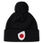 The Japan Shield Pom Pom Beanie by EMB Canterbury is black and features a unique logo of a red dot inside a white teardrop shape on the cuff, similar to the Japan Shield.