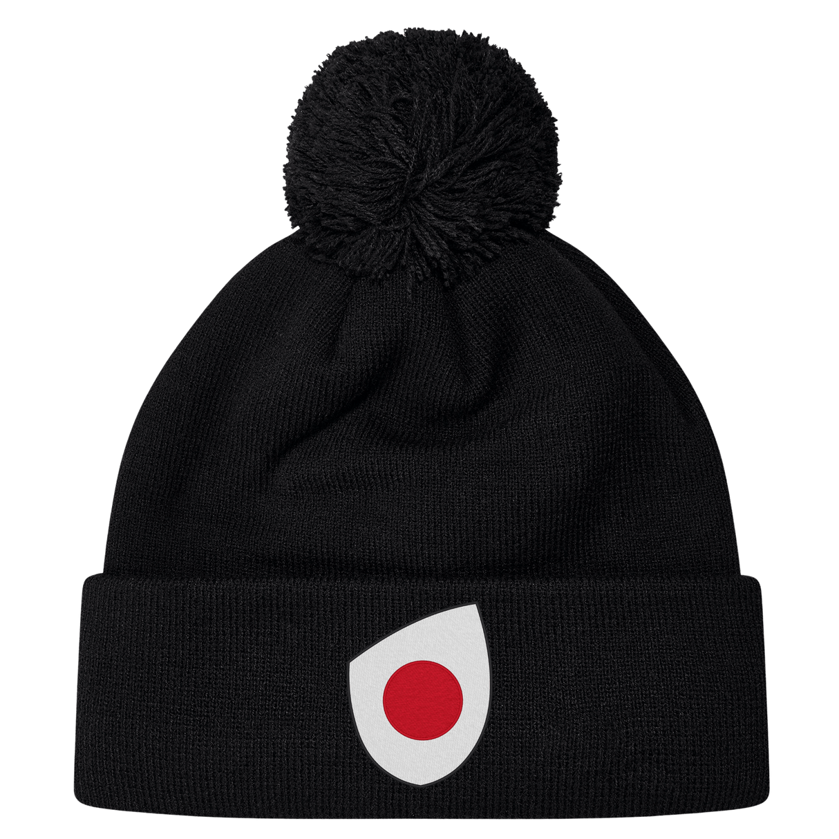 The Japan Shield Pom Pom Beanie by EMB Canterbury is black and features a unique logo of a red dot inside a white teardrop shape on the cuff, similar to the Japan Shield.