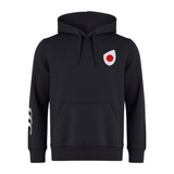 Introducing the Japan Shield Club Hoodie by EMB Canterbury: a black fleece hoodie featuring a bold red and white circle logo on the chest, complemented by Canterbury branding and three signature white stripes on the sleeves.