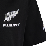Close-up of the All Blacks 26/27 Marvel Leisure Tee by adidas, a black shirt with a white silver fern and "ALL BLACKS®" on the chest, celebrating New Zealand rugby heritage.