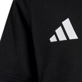 Close-up of black fabric with a white adidas logo and three diagonal stripes, from the All Blacks 26/27 Marvel Leisure Tee by adidas, celebrating New Zealand rugby.
