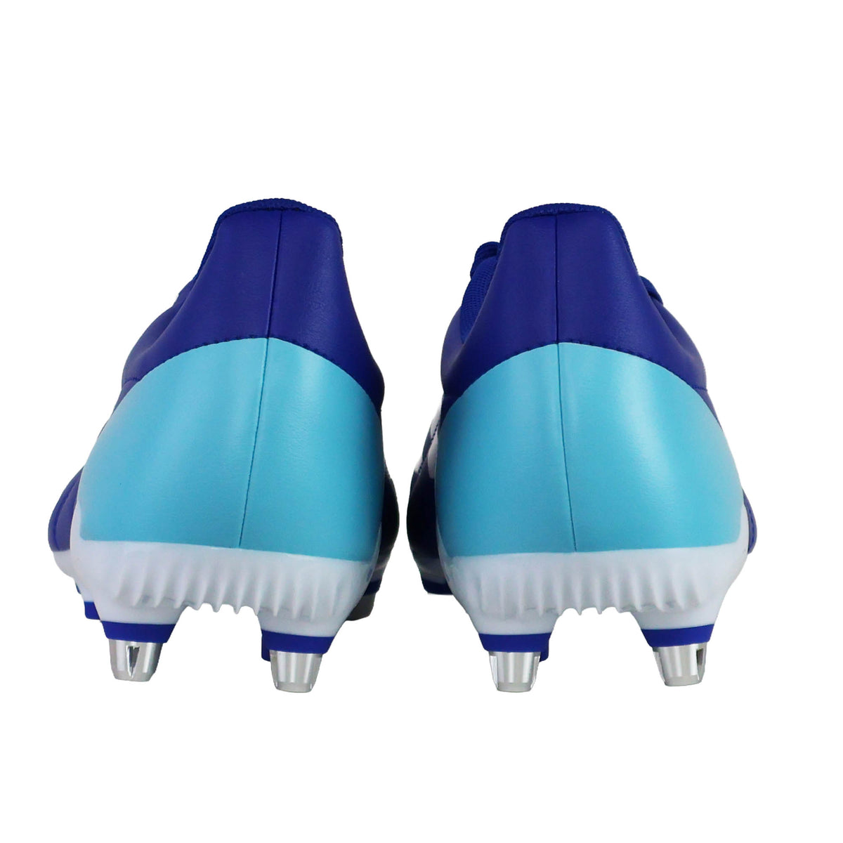 Rear view of the adidas RS-15 SG soccer cleats in Royal, White, and Light Blue, featuring white soles with metal studs designed for soft ground conditions, photographed against a white background.