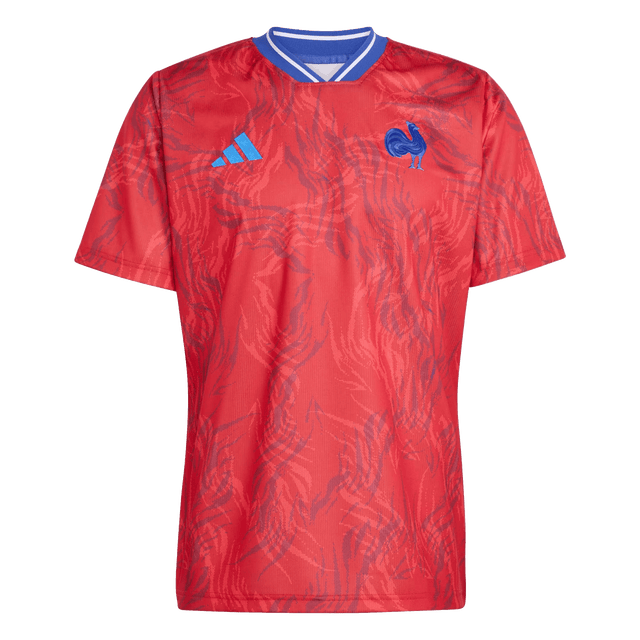 The adidas France Rugby Prematch Jersey features red short sleeves, a blue and white collar, blue adidas logo on the right chest, and a blue rooster emblem on the left. Climacool tech keeps you cool and comfortable during intense matches.
