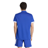 With their back to the camera, a person with short curly hair wears an adidas France FFR Home Supporters Replica Polo and matching blue shorts with white accents—a classic look for any France FFR fan.