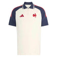 Introducing the France FFR 26/27 Training Polo by adidas—a white and navy short-sleeve training polo showcasing a striking red rooster logo, a navy collar, and signature red adidas stripes on the shoulders. This stylish piece is inspired by the iconic France Rugby polo as worn by the French Rugby Federation.