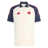 Introducing the France FFR 26/27 Training Polo by adidas—a white and navy short-sleeve training polo showcasing a striking red rooster logo, a navy collar, and signature red adidas stripes on the shoulders. This stylish piece is inspired by the iconic France Rugby polo as worn by the French Rugby Federation.