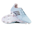 A pair of adidas RS-15 Avaglide Rise SG women’s rugby boots in Ice Blue, Iron, and Pink, featuring black stripes and white soles with metal and pink studs. One shoe is upright and the other displays the sole, making them ideal soft ground rugby boots.