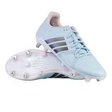 A pair of adidas RS-15 Avaglide Rise SG women’s rugby boots in Ice Blue, Iron, and Pink, featuring black stripes and white soles with metal and pink studs. One shoe is upright and the other displays the sole, making them ideal soft ground rugby boots.