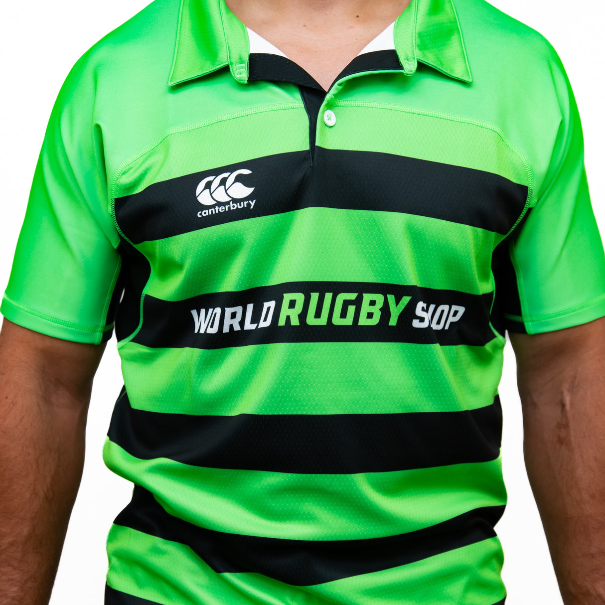 A person wearing the Teamatical Canterbury Elite Full Custom Sublimated Jersey - Mens, featuring a bright green and black striped design.