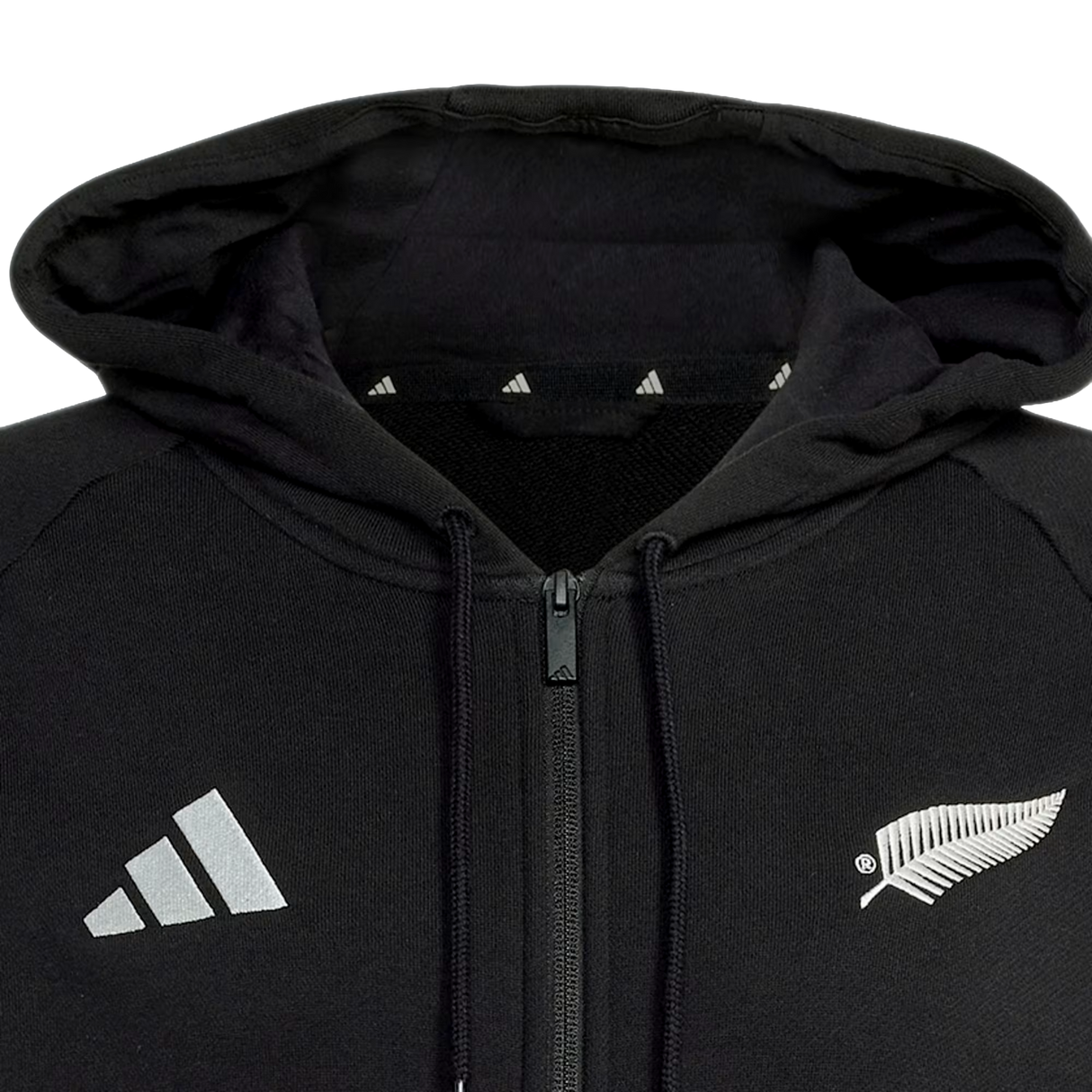 The All Blacks 26/27 Travel Full Zip Hoodie by adidas features a hood, adidas logo on the left, and white fern on the right—perfect for New Zealand rugby or All Blacks hoodie fans.