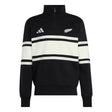 The All Blacks 26/27 Leisurewear 1/4 Zip Sweatshirt by adidas features a classic black and white design with two bold horizontal white stripes, the iconic adidas logo on the right chest, and a silver fern emblem on the left chest. This adidas pullover is the perfect blend of comfort and style for New Zealand Rugby fans, making it an essential piece of All Blacks leisurewear.