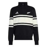 The All Blacks 26/27 Leisurewear 1/4 Zip Sweatshirt by adidas features a classic black and white design with two bold horizontal white stripes, the iconic adidas logo on the right chest, and a silver fern emblem on the left chest. This adidas pullover is the perfect blend of comfort and style for New Zealand Rugby fans, making it an essential piece of All Blacks leisurewear.