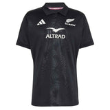 Introducing the All Blacks Greatest Rivalry Replica Home Jersey by adidas—a black rugby polo shirt adorned with adidas, Altrad, and All Blacks logos. Its subtle fern pattern on the front pays tribute to rugby heritage.