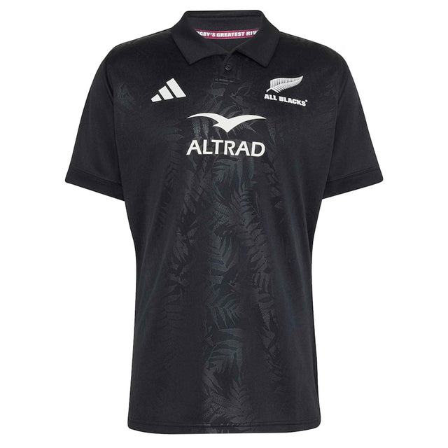 Introducing the All Blacks Greatest Rivalry Replica Home Jersey by adidas—a black rugby polo shirt adorned with adidas, Altrad, and All Blacks logos. Its subtle fern pattern on the front pays tribute to rugby heritage.