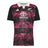 Introducing the All Blacks 26/27 Training Jersey - South Africa Tour by adidas: a short-sleeve rugby jersey featuring a crisp white collar, bold black sleeves, and an eye-catching pink and purple leaf pattern. This adidas design displays the All Blacks, adidas, and Toyota logos on the front and is crafted as an official training jersey inspired by the All Blacks’ tour of South Africa.