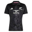 Elevate your rugby collection with the All Blacks Greatest Rivalry Performance Home Jersey by adidas—a black short-sleeve jersey featuring a distinctive fern pattern, classic collar with “RUGBY’S GREATEST” printed inside, and bold white sponsor and team logos, designed for true fans of performance rugby shirts.