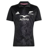 Elevate your rugby collection with the All Blacks Greatest Rivalry Performance Home Jersey by adidas—a black short-sleeve jersey featuring a distinctive fern pattern, classic collar with “RUGBY’S GREATEST” printed inside, and bold white sponsor and team logos, designed for true fans of performance rugby shirts.