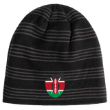 The EMB Canterbury Kenya Shield Beanie is a black and grey striped hat featuring the Kenya Shield emblem, ideal for proudly displaying your love for Kenya.