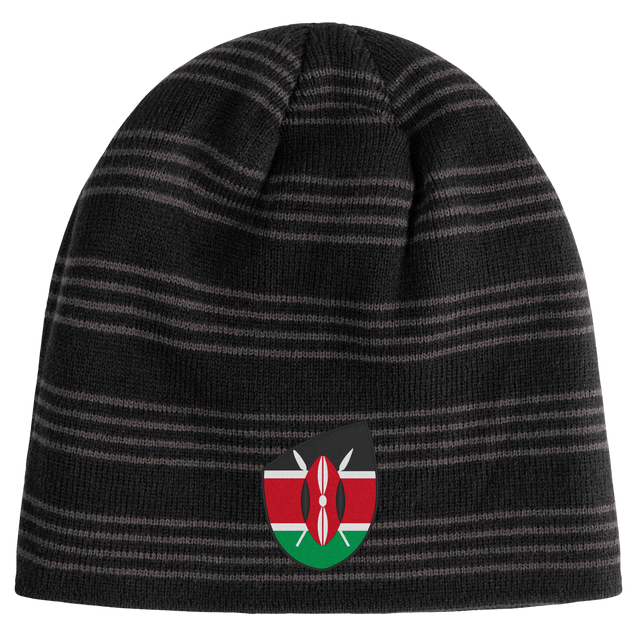 The EMB Canterbury Kenya Shield Beanie is a black and grey striped hat featuring the Kenya Shield emblem, ideal for proudly displaying your love for Kenya.