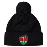 Just In: The stylish Kenya Shield Pom Pom Beanie by EMB Canterbury, featuring a black design with the iconic Kenya Shield emblem on the front and a fashionable pom-pom.