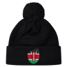 Just In: The stylish Kenya Shield Pom Pom Beanie by EMB Canterbury, featuring a black design with the iconic Kenya Shield emblem on the front and a fashionable pom-pom.