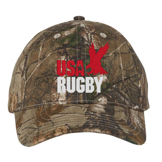 The USA Rugby Throwback Licensed Camo Cap - Realtree Xtra by EMB S&S Activewear features "USA RUGBY" text and a red eagle graphic, perfect for any fan of USA Rugby caps.