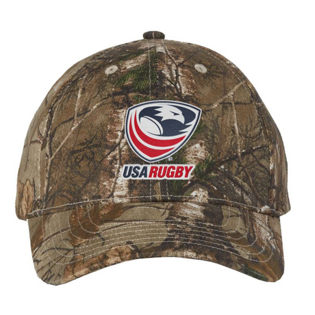 The EMB S&S Activewear USA Rugby Licensed Camo Cap - Realtree Xtra features an authentic camo pattern and a USA Rugby logo patch for a sporty, rugged look.