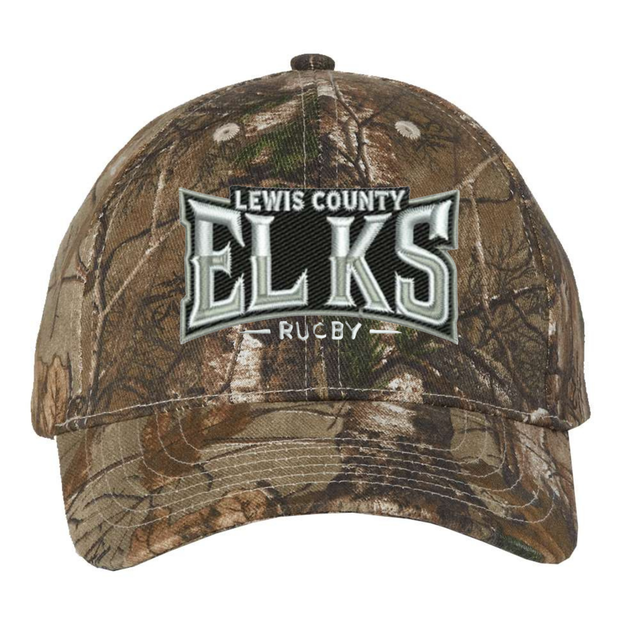 Introducing the Lewis County Elks Realtree Camo Cap by EMB S&S Activewear—a classic adjustable hat featuring “Lewis County Elks Rugby” embroidered in white and gray on the front, showcasing a timeless Realtree Xtra pattern for exceptional style and comfort.