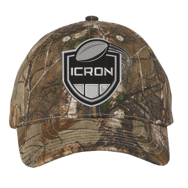 ICRON Realtree Camo Cap featuring an adjustable woodland print, an embroidered shield and football logo, and “ICRON” text.