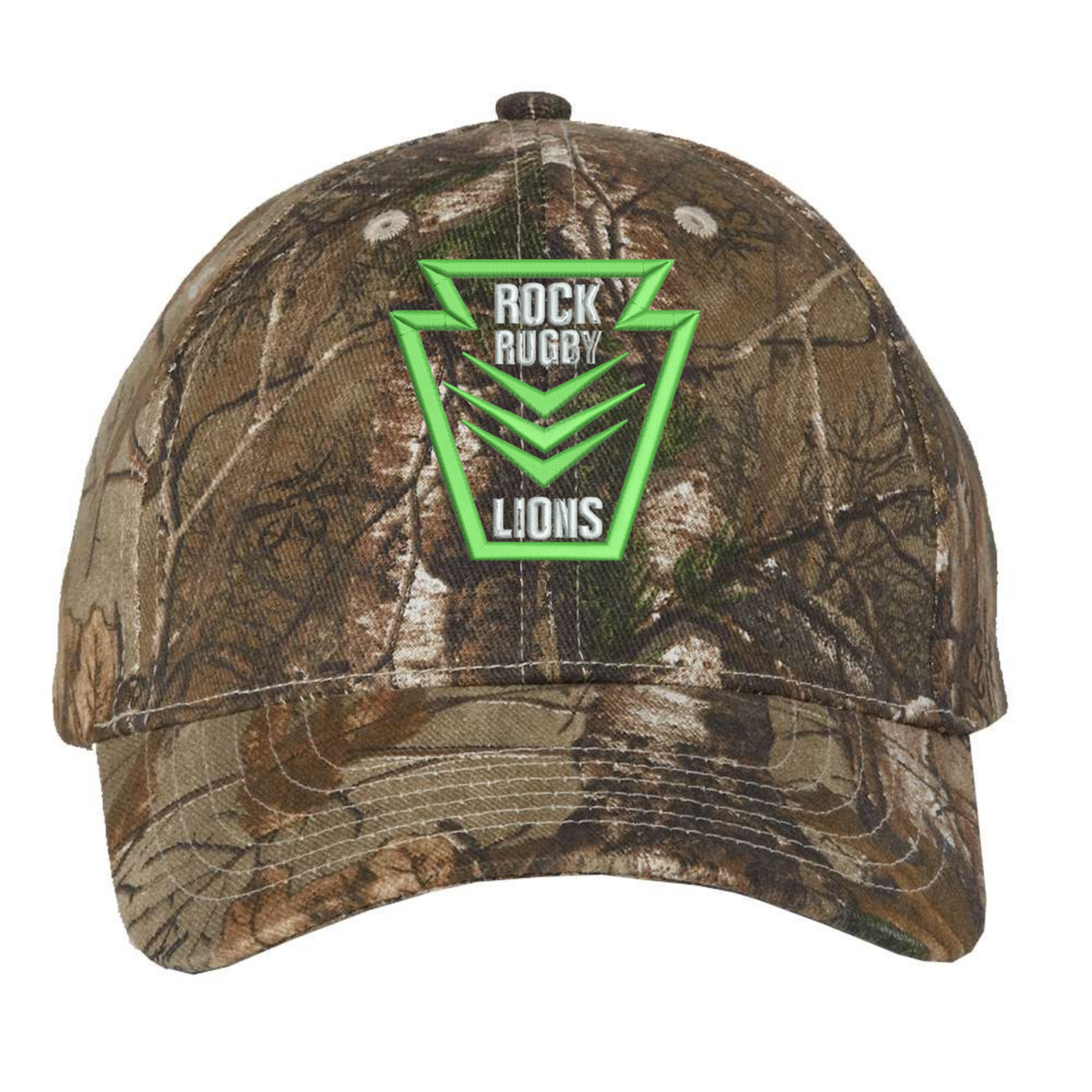 Rock Rugby Realtree Camo Cap in a woodland print with an adjustable strap and a green and white “ROCK RUGBY LIONS” shield logo on the front.