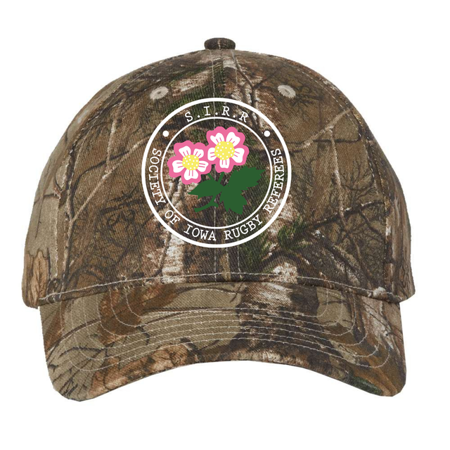The Society of Iowa Rugby Referees Realtree Camo Cap by EMB S&S Activewear features a round logo with three pink flowers on the front and an adjustable closure for a perfect fit.