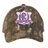 Western Carolina University Realtree Camo Cap featuring an adjustable fit and a purple and white shield emblem with “Western Carolina Rugby” and “1990” printed on it.