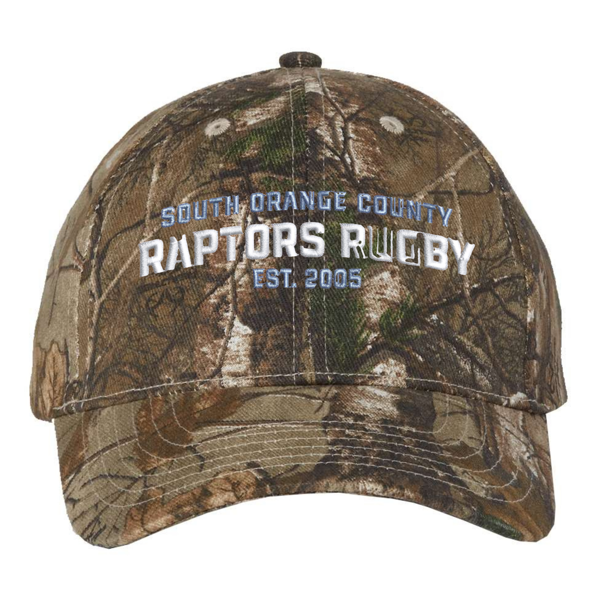 Introducing the South Orange County Raptors Realtree Camo Cap by EMB S&S Activewear. This adjustable baseball hat showcases “South Orange County Raptors Rugby Est. 2005” embroidered in white and blue on the front, all set against the popular Realtree Xtra camouflage pattern. Combining comfort with a rugged style, it’s the perfect cap for any fan.