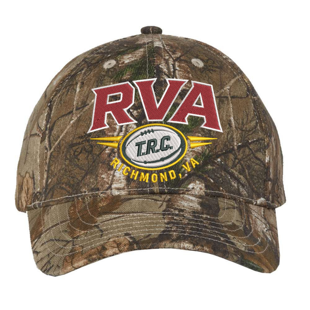 The RVA T.R.C. Realtree Camo Cap by EMB S&S Activewear features “RVA,” “T.R.C.,” and “Richmond, VA” embroidered on the front in red, white, and yellow thread. The cap is designed with an adjustable closure for a comfortable fit.