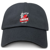 The EMB S&S Activewear Lincoln City Youth Rugby Adult Low-Profile Cotton Twill Dad Cap features embroidered team branding—a rugby ball and white building logo on the front.